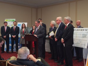 Rep. Goodlatte speaks at press conference, flanked by supporters, including NCC President Mike Brown (far right)
